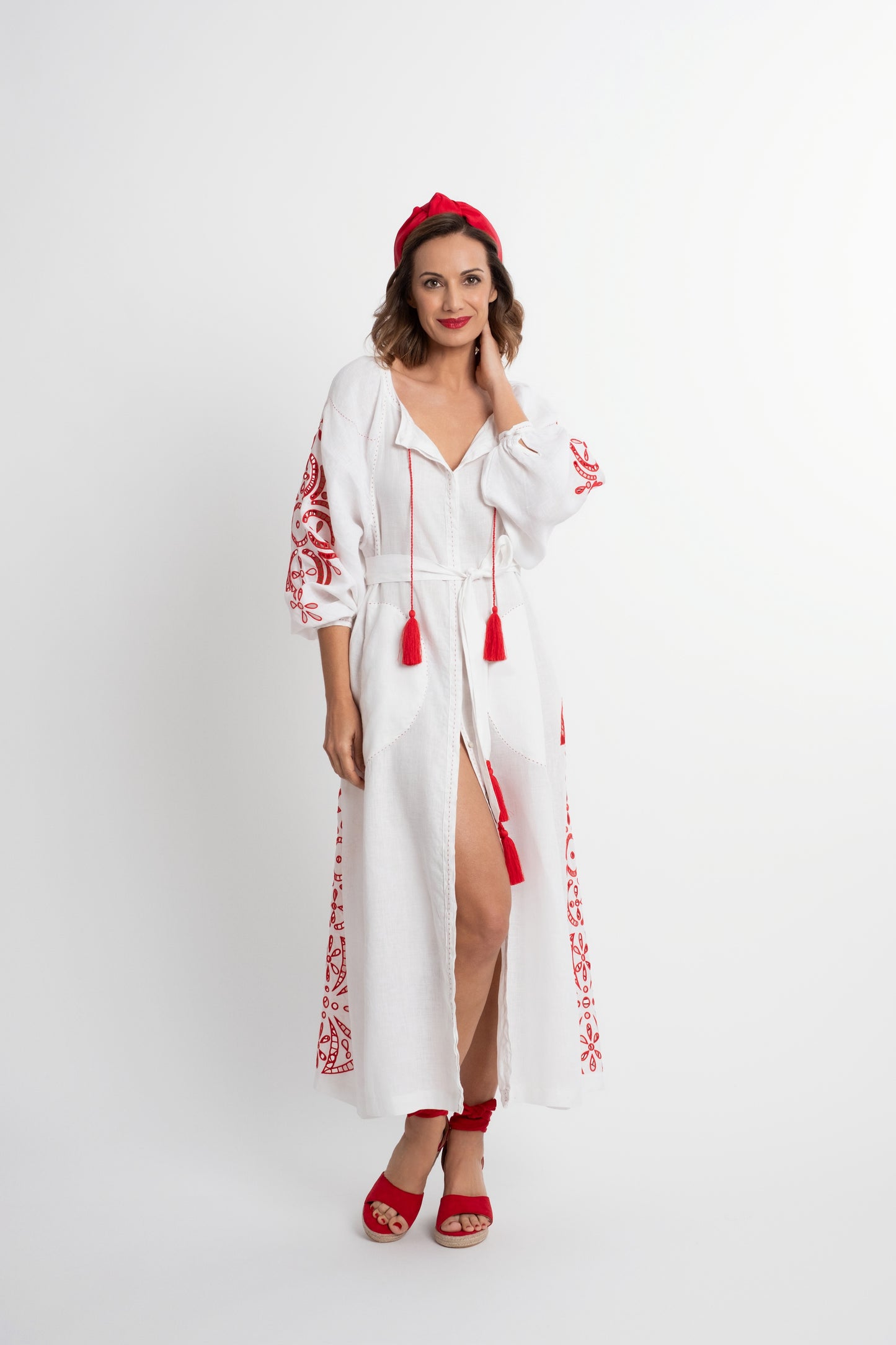 Santorini: White linen belted dress embroidered in red with pompons and  mother of pearl buttons.