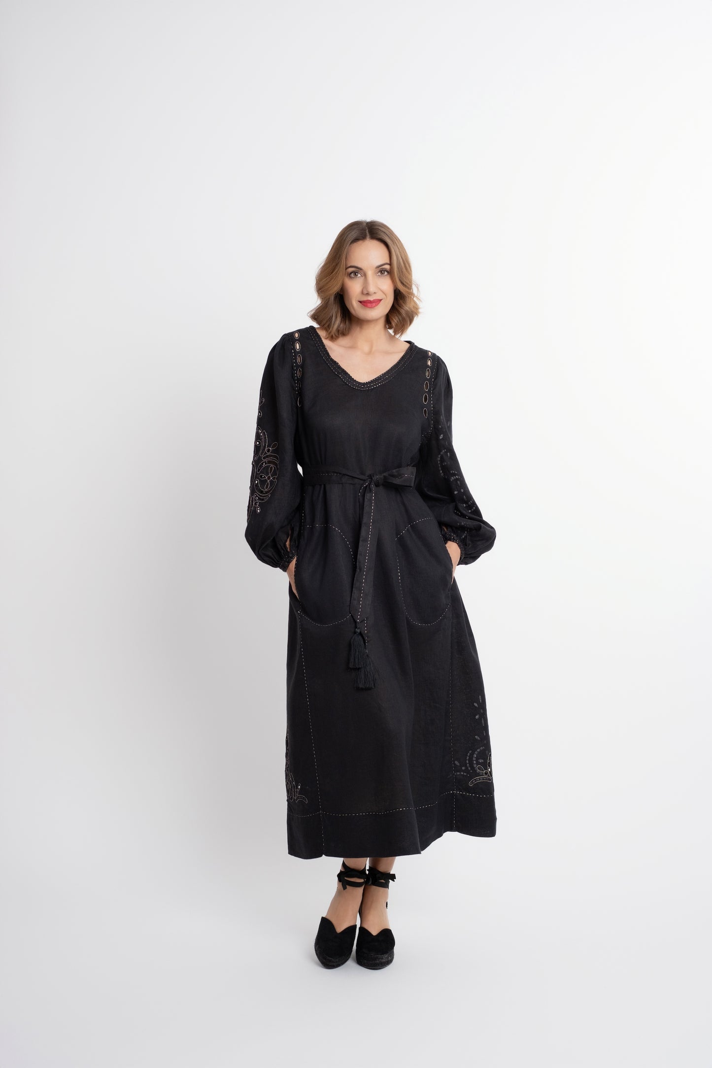 Creta: Black linen belted dress embroidered in gold.