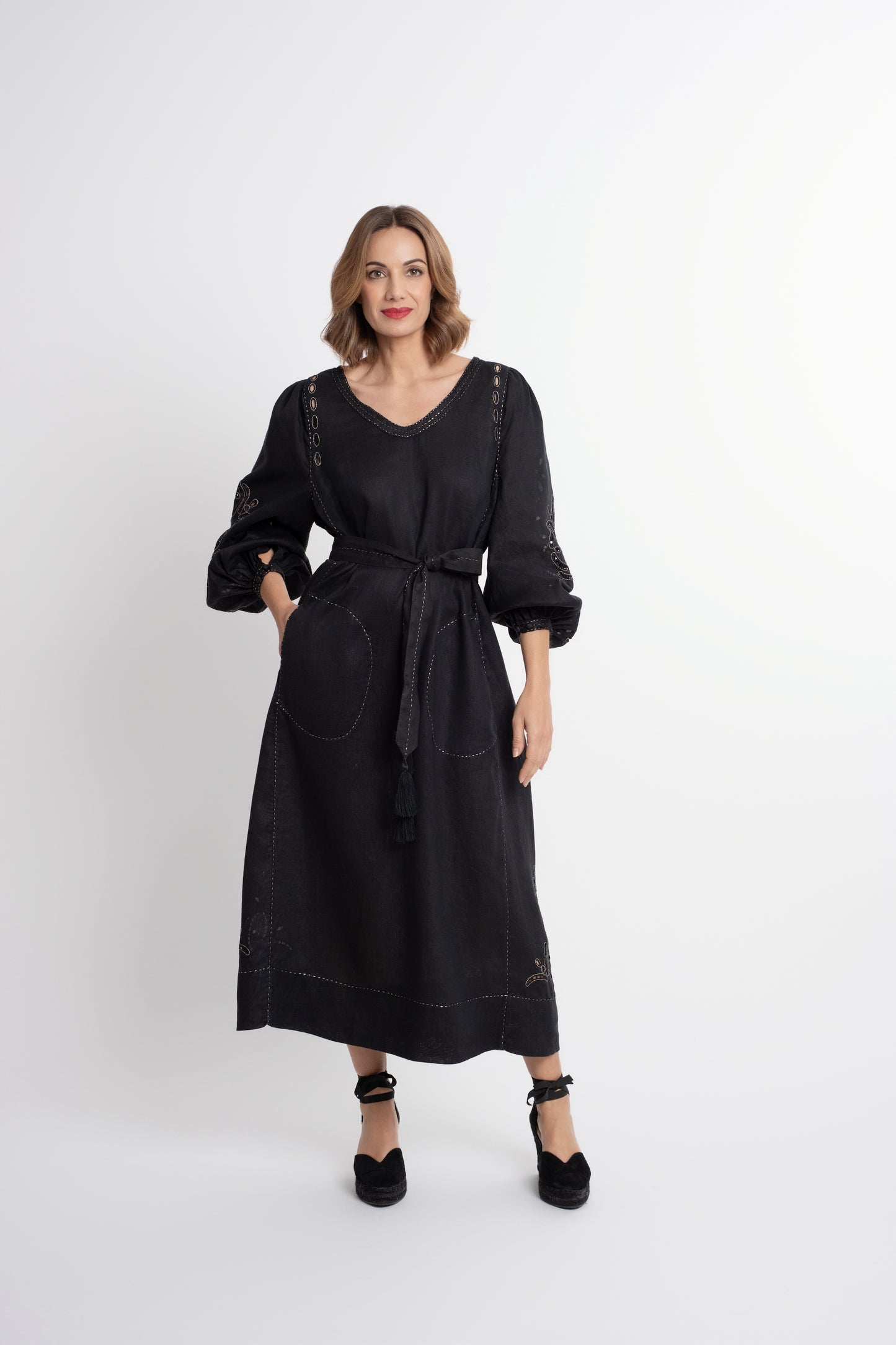 Creta: Black linen belted dress embroidered in gold.