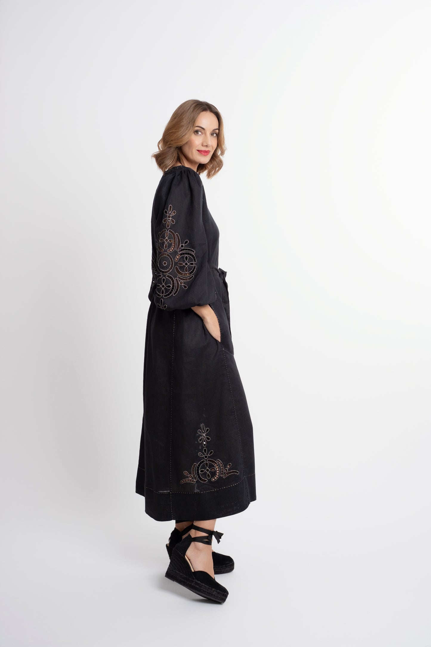 Creta: Black linen belted dress embroidered in gold.