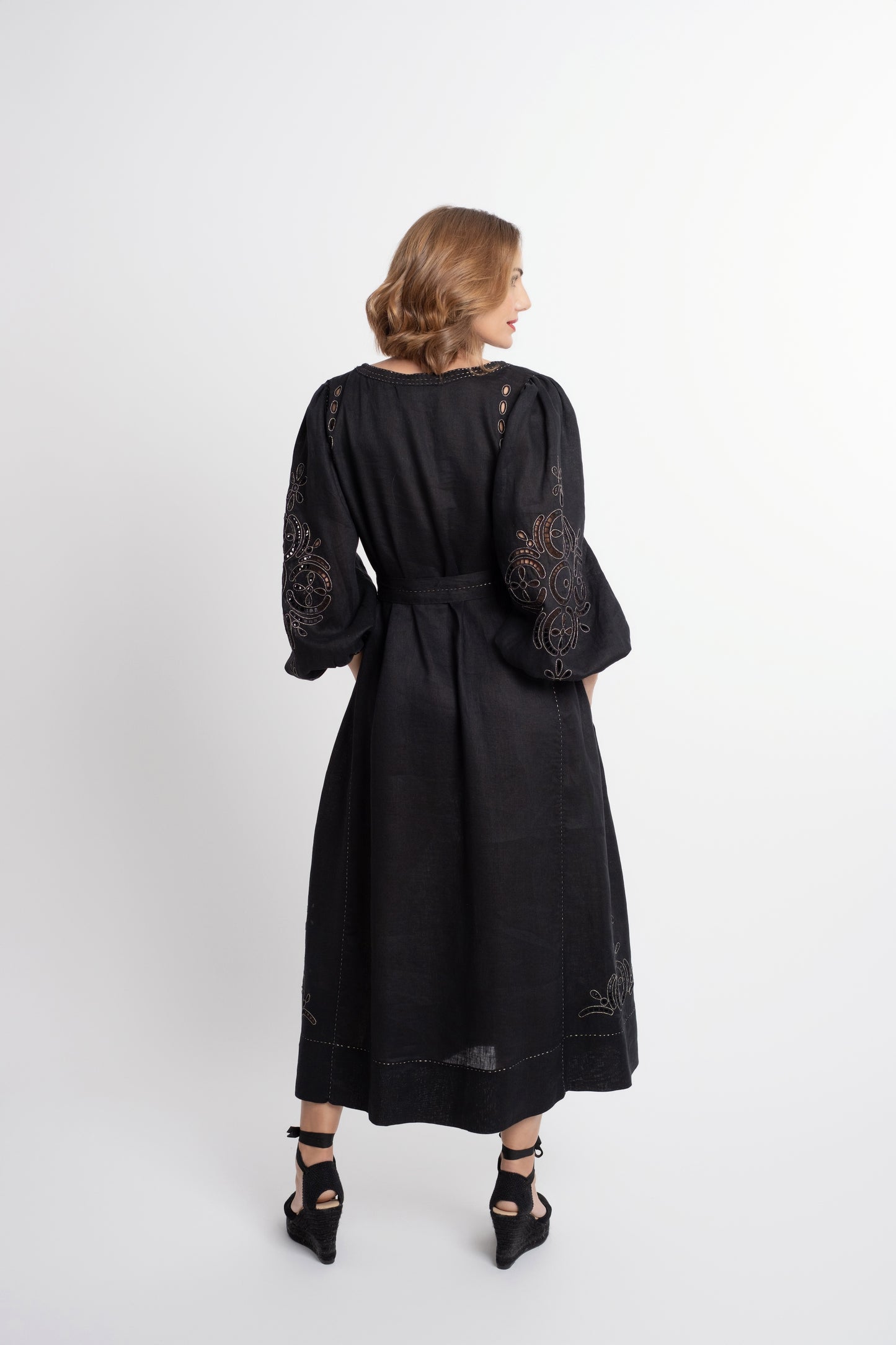 Creta: Black linen belted dress embroidered in gold.