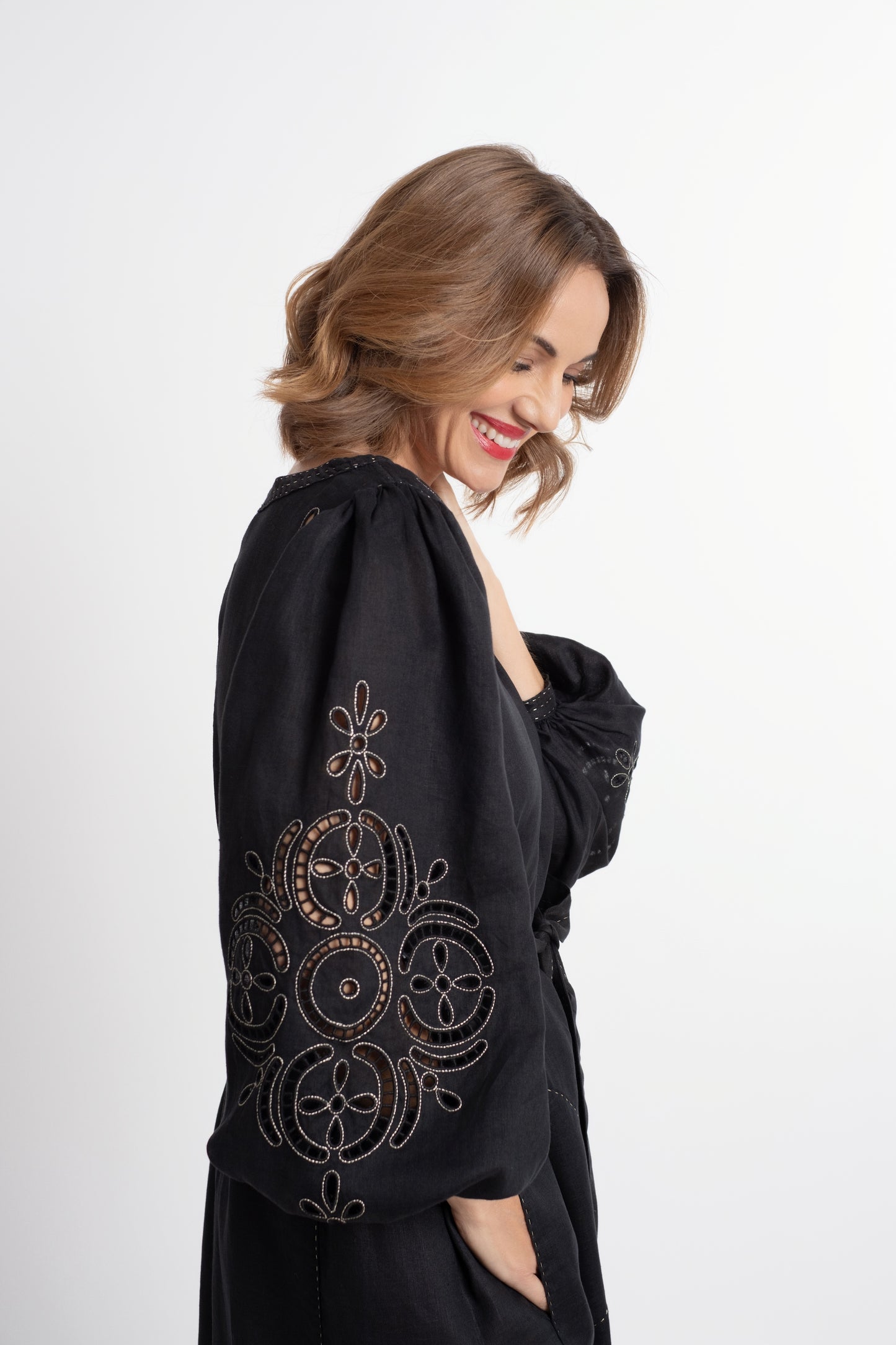 Creta: Black linen belted dress embroidered in gold.