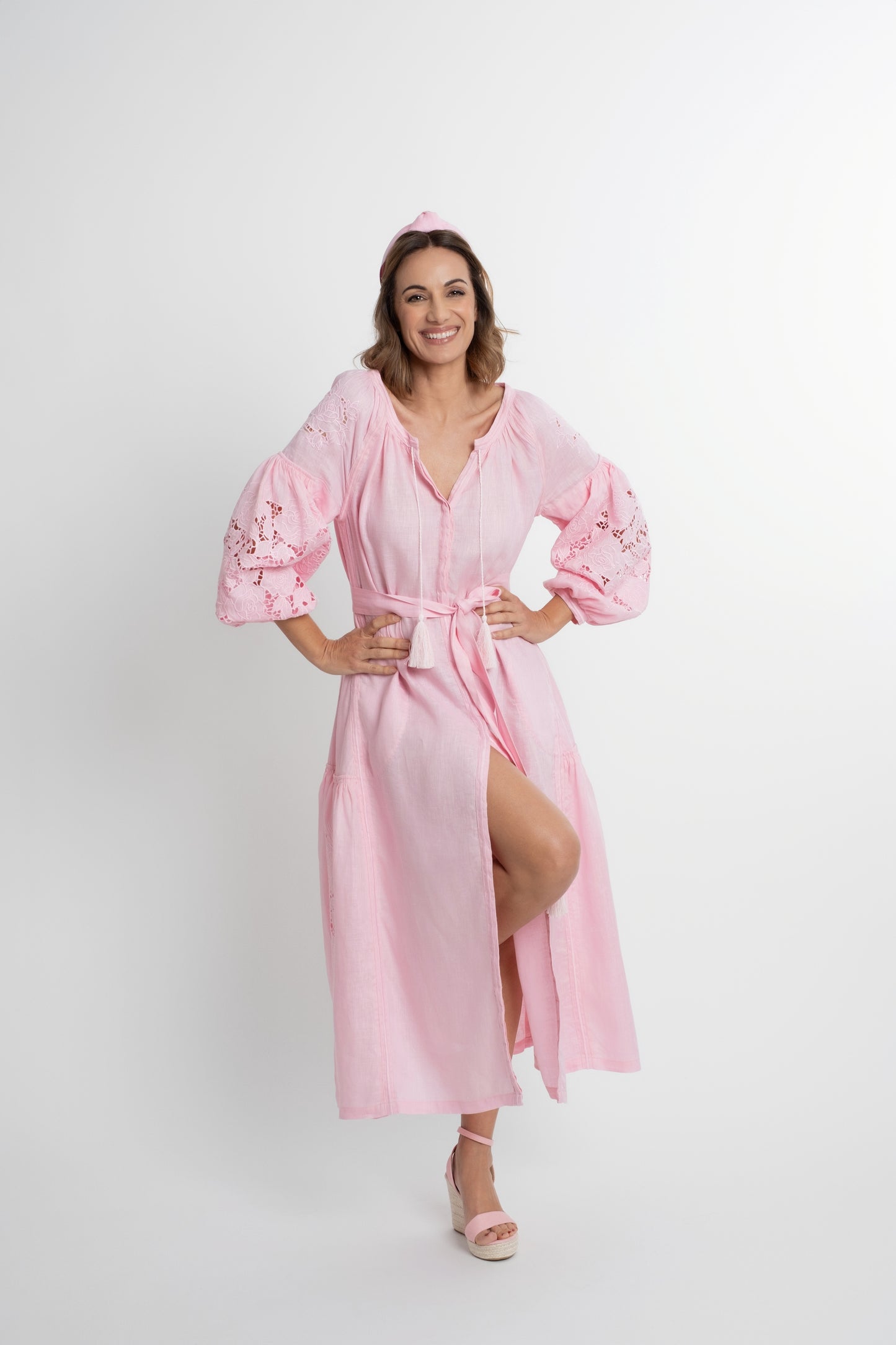 Capri: Pink linen belted dress cut swiss embroidered with pompons and  mother of pearl buttons.