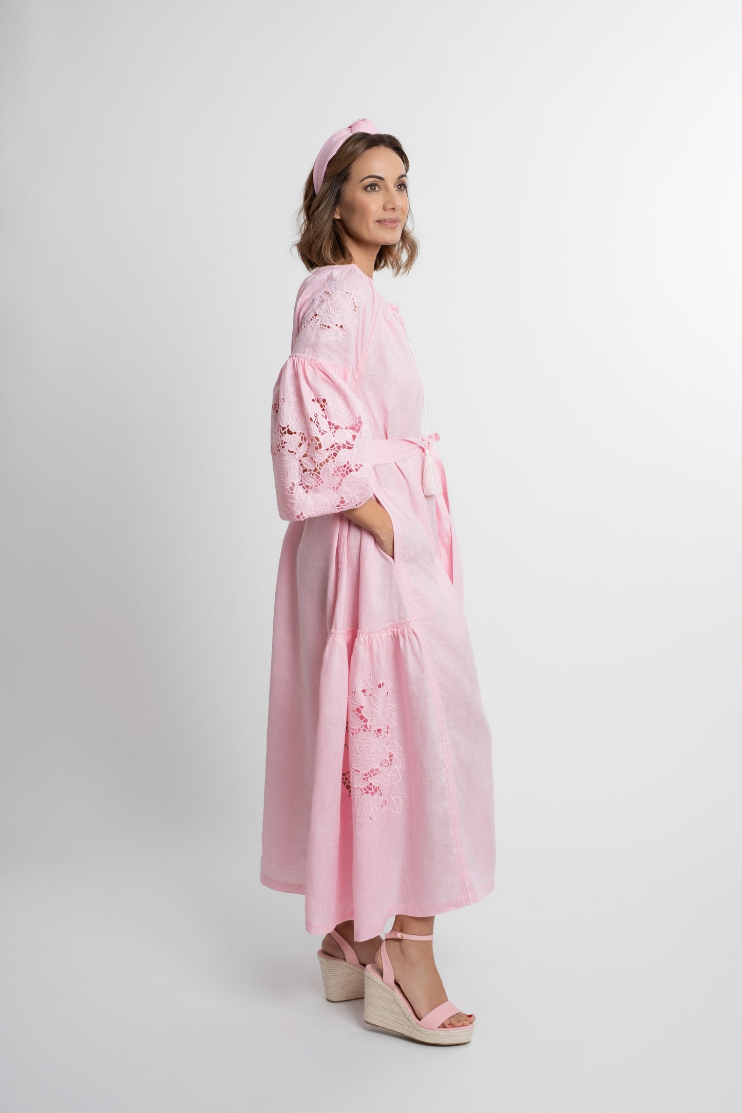 Capri: Pink linen belted dress cut swiss embroidered with pompons and  mother of pearl buttons.