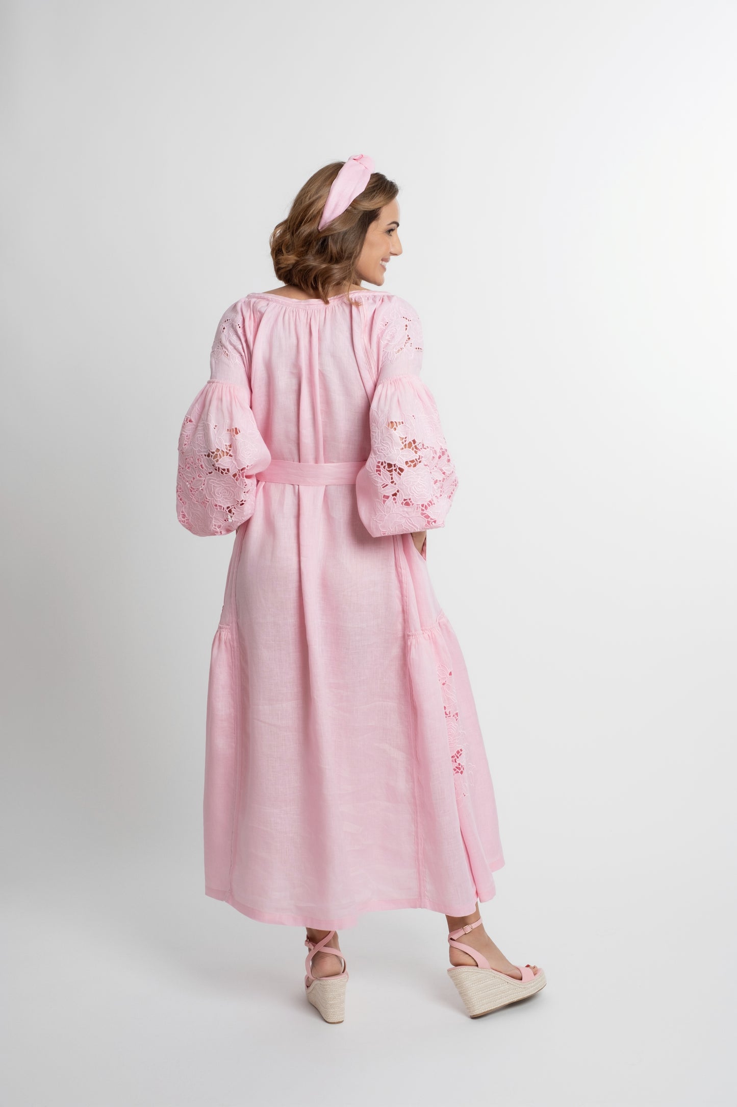 Capri: Pink linen belted dress cut swiss embroidered with pompons and  mother of pearl buttons.