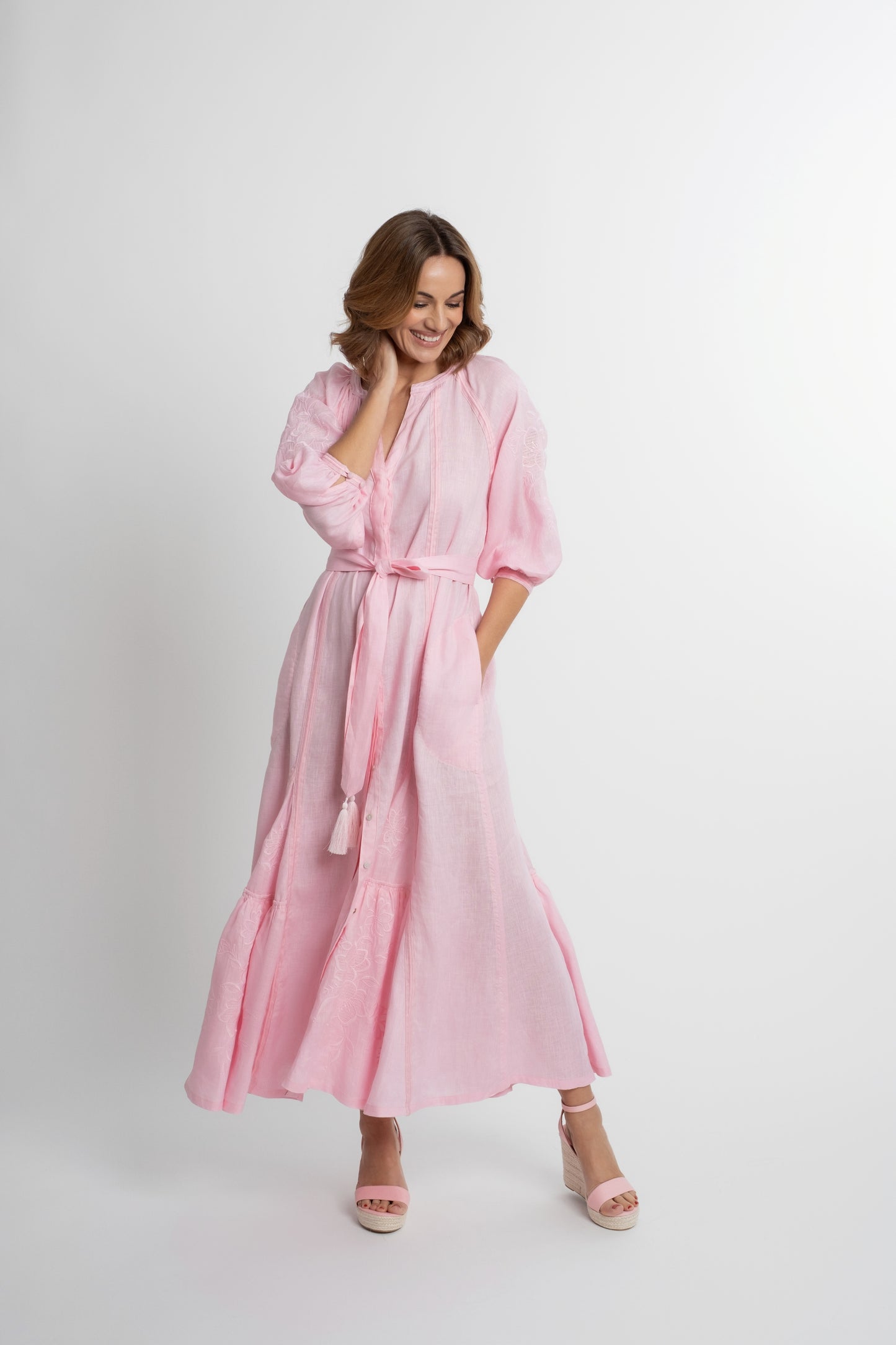 Ibiza: All pink linen belted dress embroidered with pompons and  mother of pearl buttons.