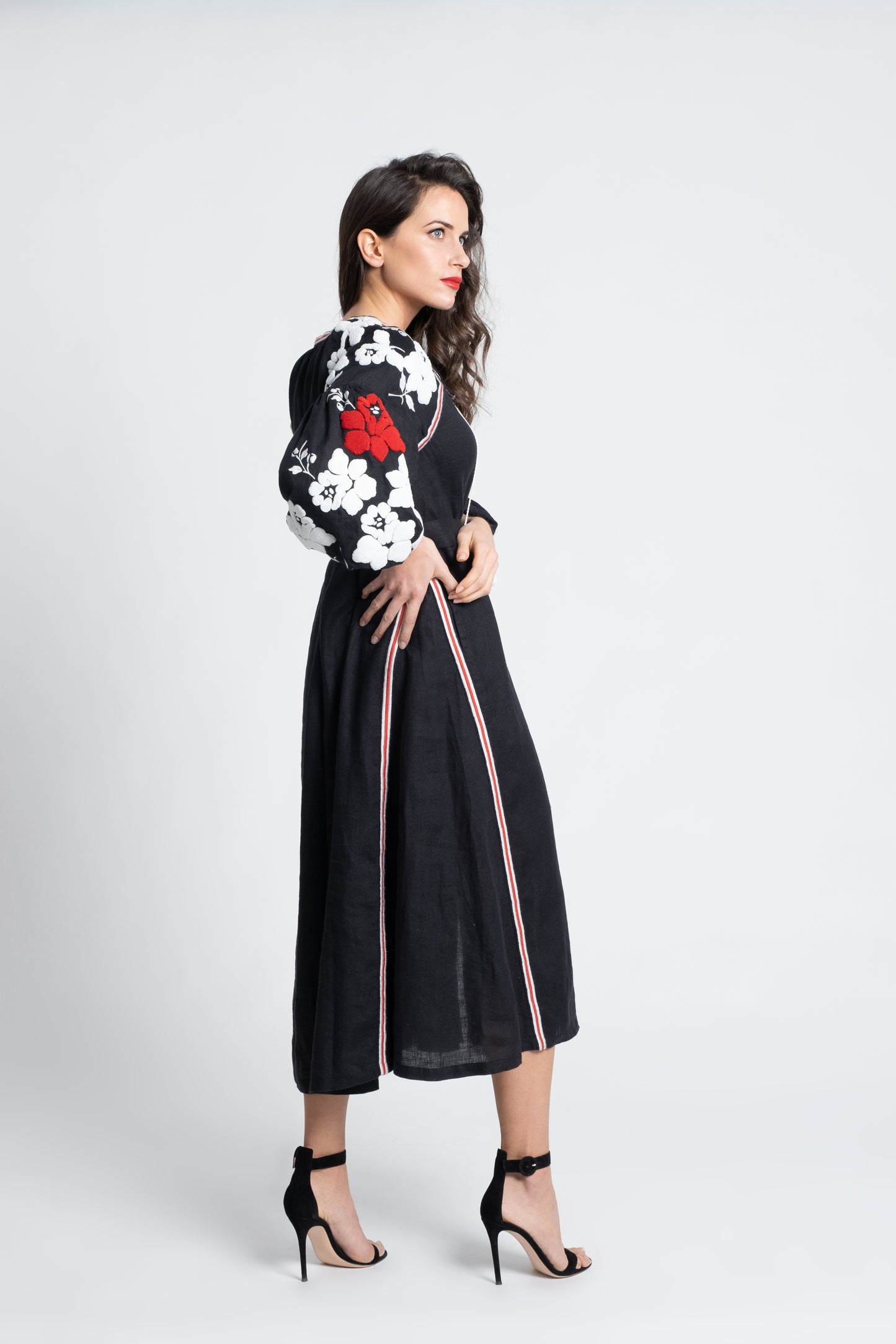 Malibu: Black linen belted dress embroidered in white and red with pompons and  mother of pearl buttons.