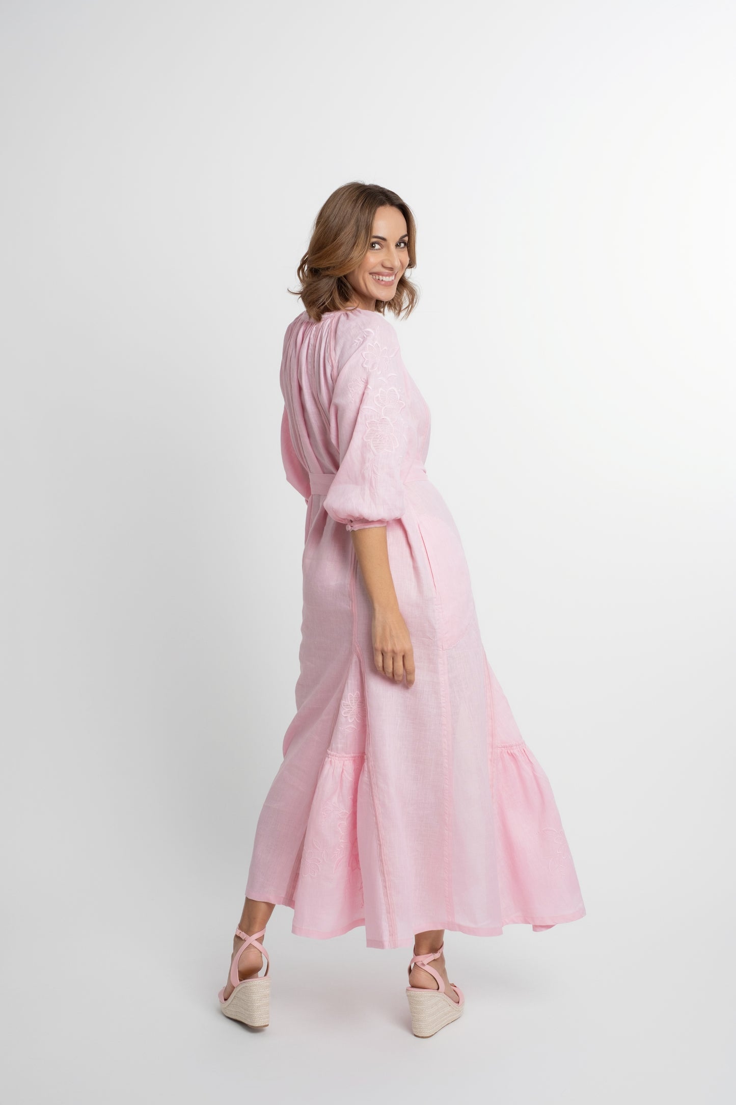 Ibiza: All pink linen belted dress embroidered with pompons and  mother of pearl buttons.