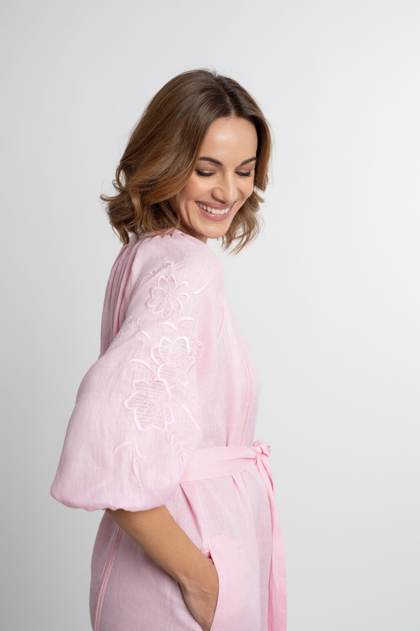 Ibiza: All pink linen belted dress embroidered with pompons and  mother of pearl buttons.