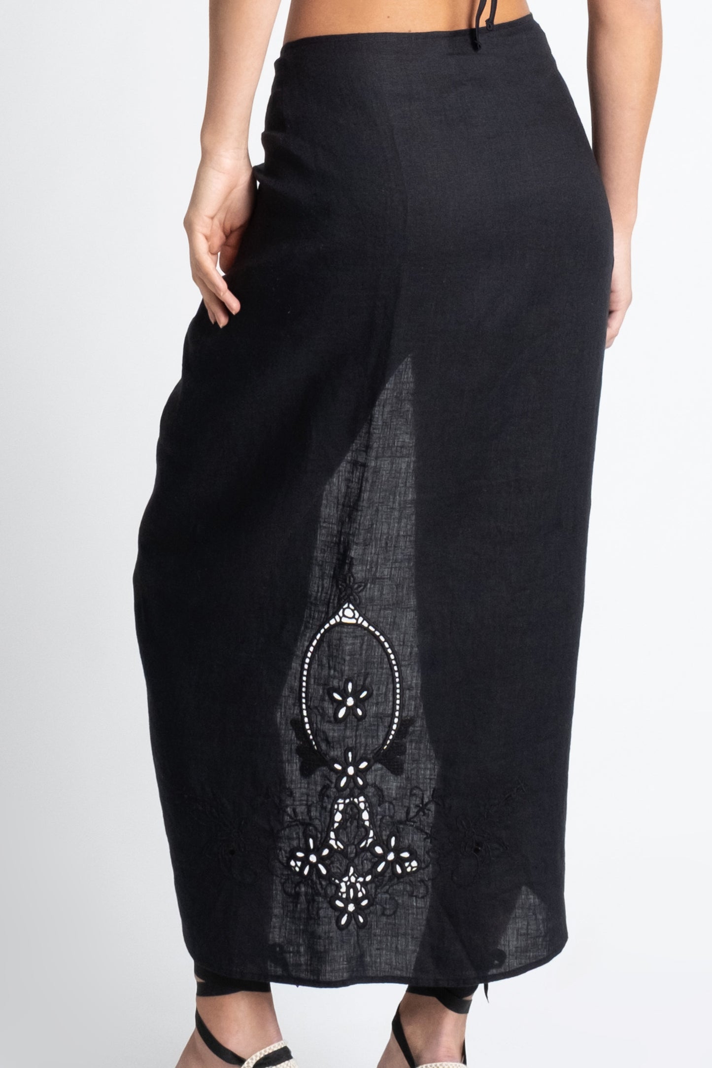 Embroidered black linen sarong.