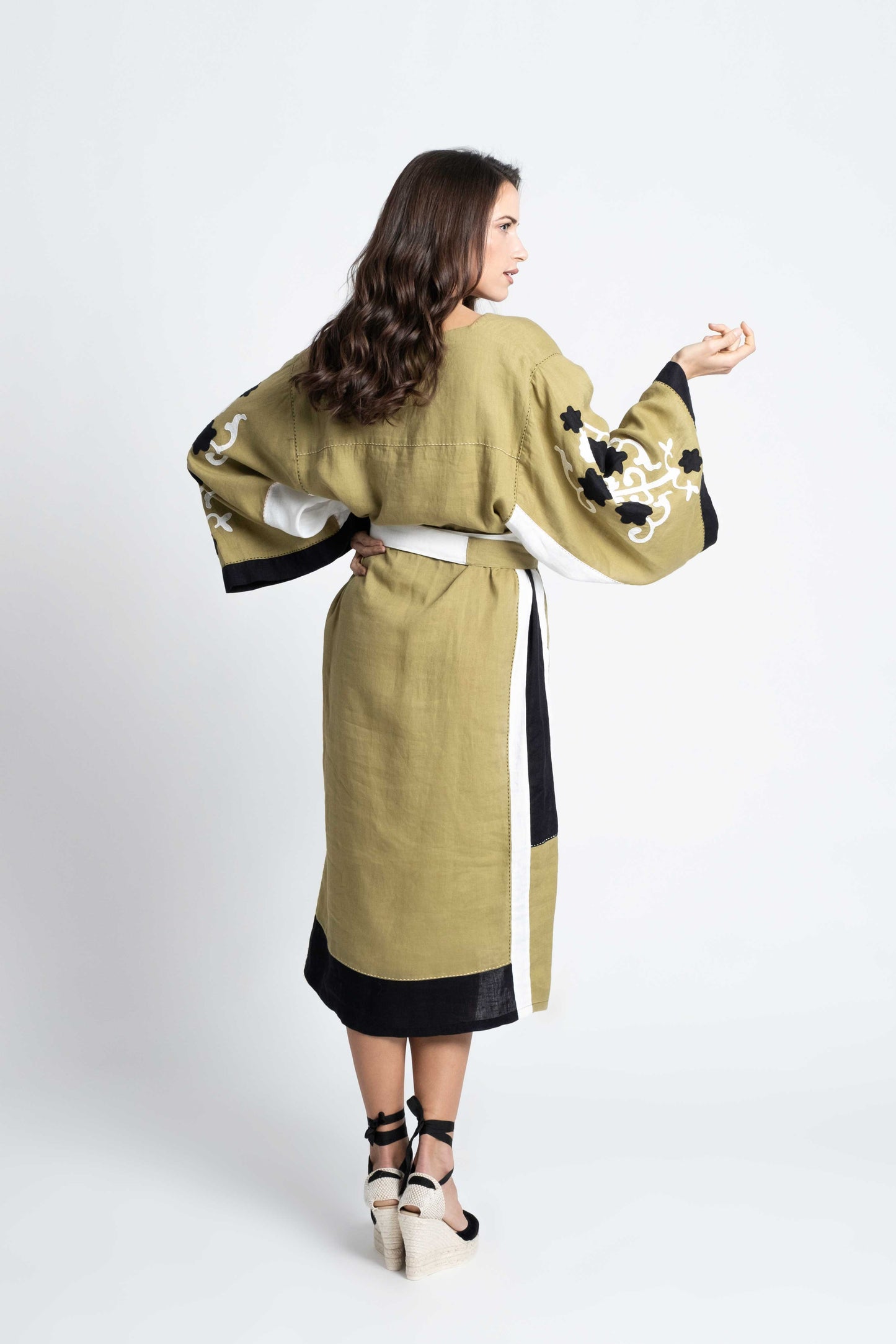 Olive linen belted dress embroidered in black and white.