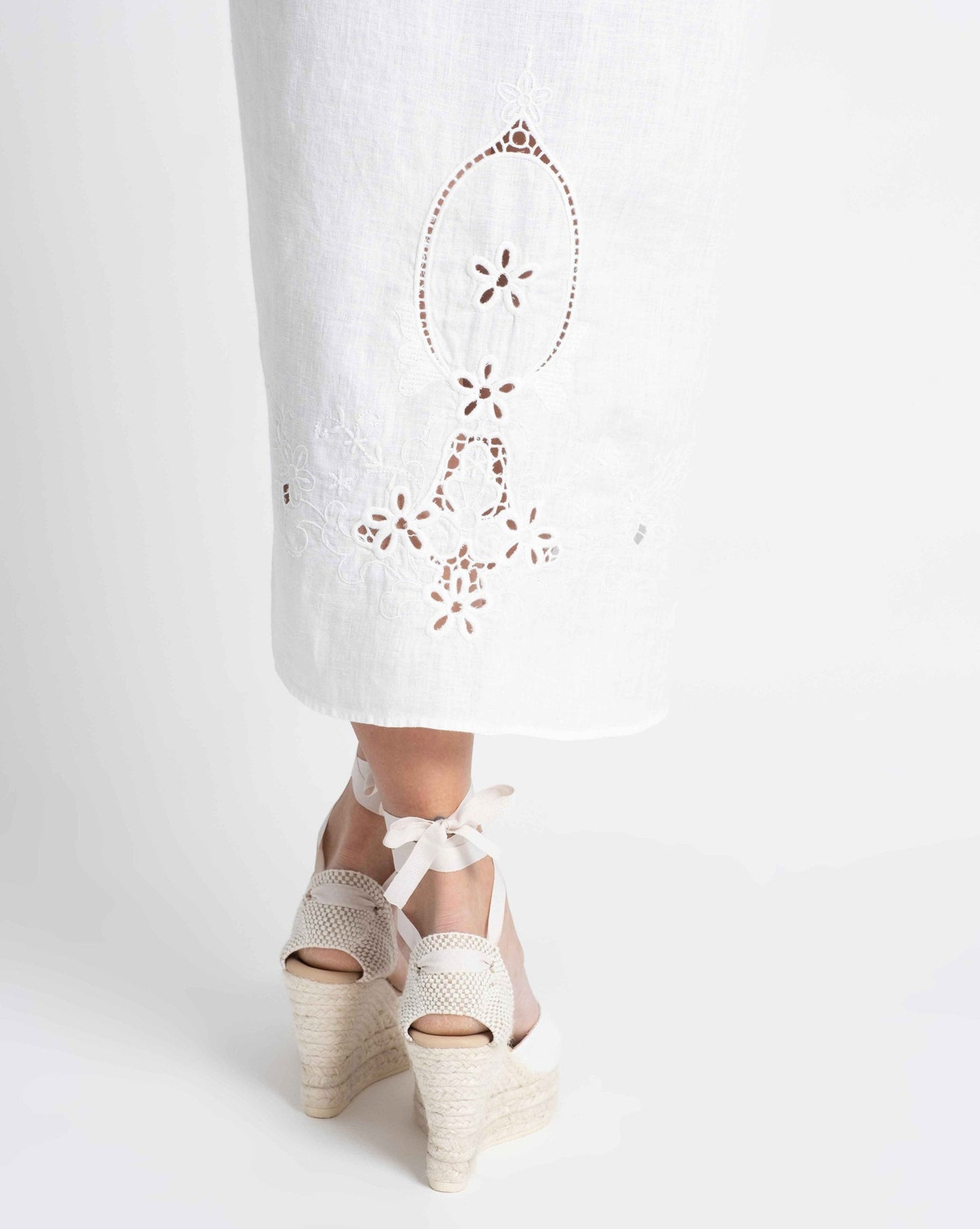 Seychelles: Embroidered white linen sarong.