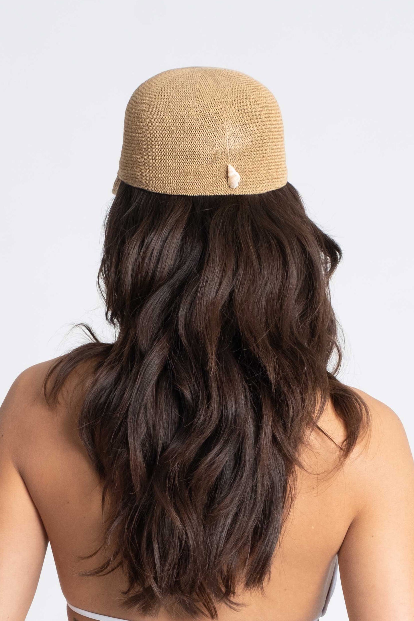 camel straw cap with natural shell.